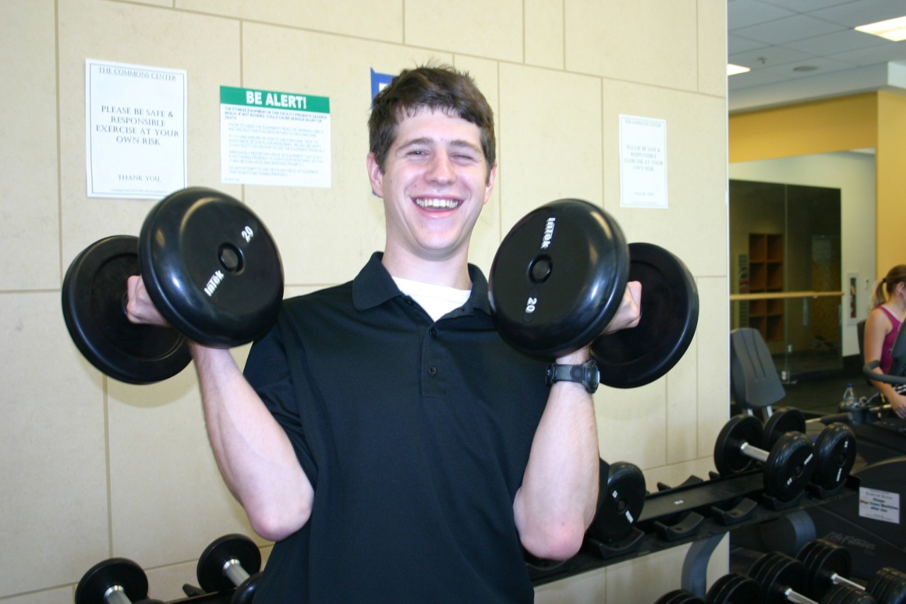 Andrew van Cleave, Next Steps class of 2011 Andrew van Cleave when he was at Next Steps, holding two weights in the gym with a big smile.
