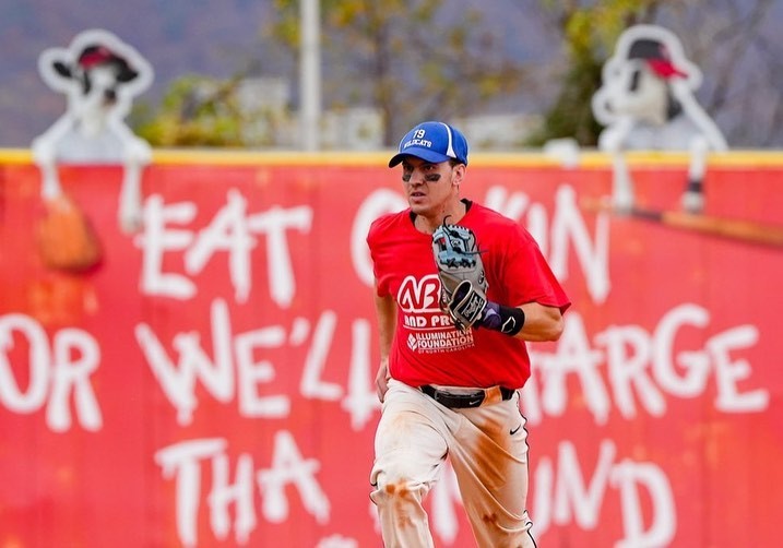 baseball player running between bases