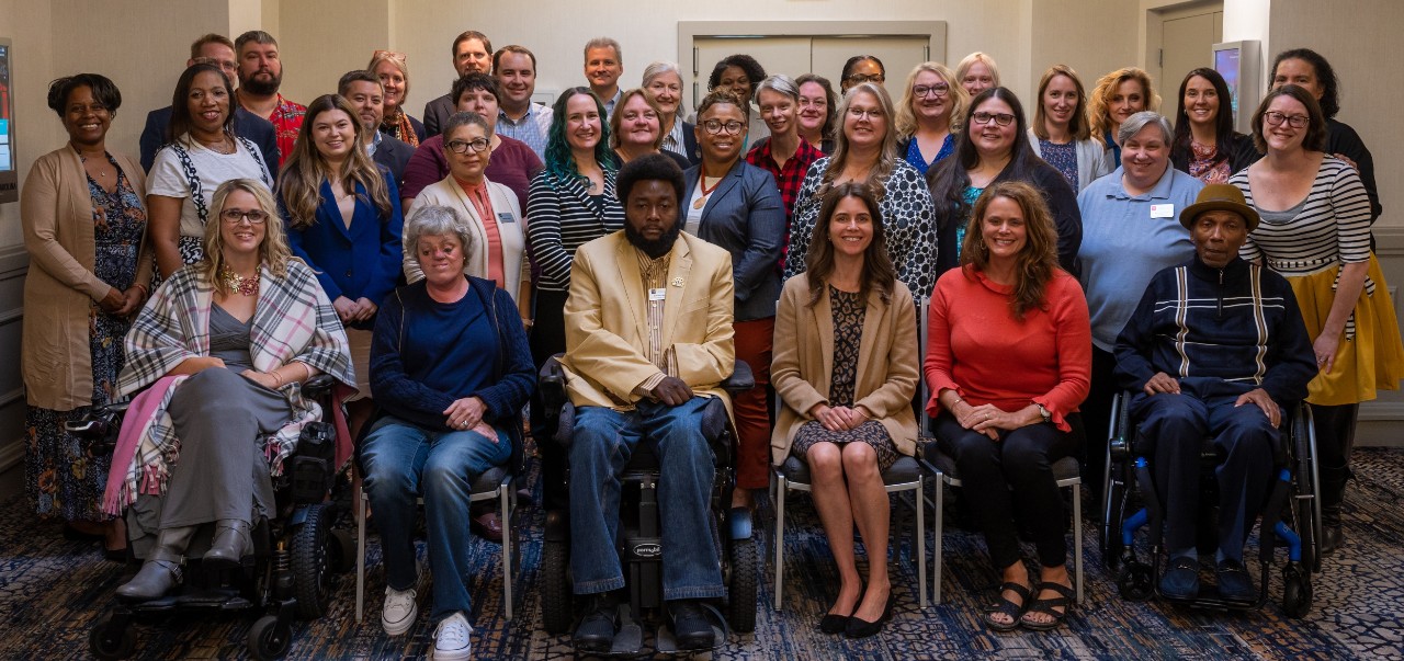 group photo of Council members, staff, and agency representatives - posed group photo of about 40 people