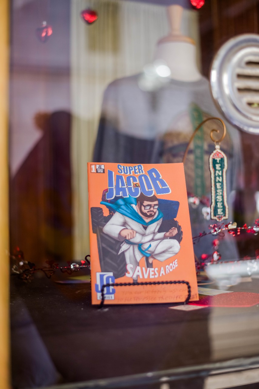 Super Jacob comic book sitting in theatre glass box