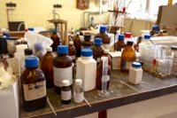 chemical bottles on a laboratory table chemical bottles on a laboratory table