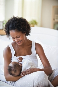 mother breast feeding baby