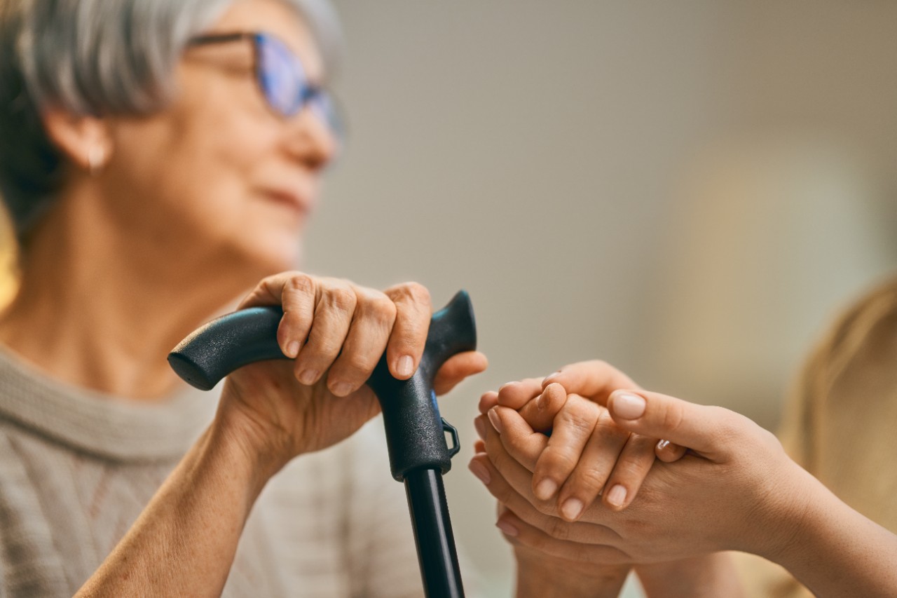 Adult holding cane