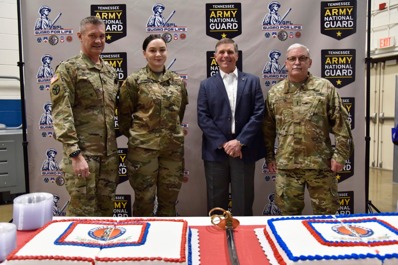 19_20_p_1 (L to R) Maj. Gen. Jeff Holmes, Tennessee’s Adjutant General, Pfc. Lindsey Jackson with the 301st Troop Command, retired Chief Warrant Officer 5 Robert Huffman, representative of the Association of the U.S. Army and Chief Warrant Officer 4 Frank Rodriguez