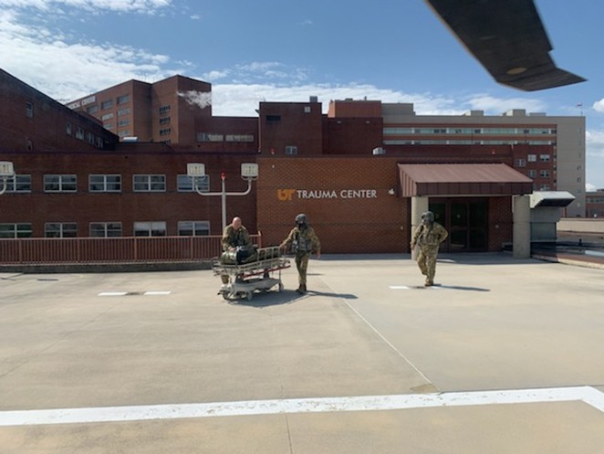 A Tennessee Army National Guard medical flight crew responded to an emergency air evacuation mission after a hiker suffered a stroke while on the Appalachian Trail, April 15. The flight crew successfully transported the patient to the University of Tennessee Medical Center in Knoxville. (Courtesy Photo from the Tennessee National Guard) Guard members in front of UT Trauma Center