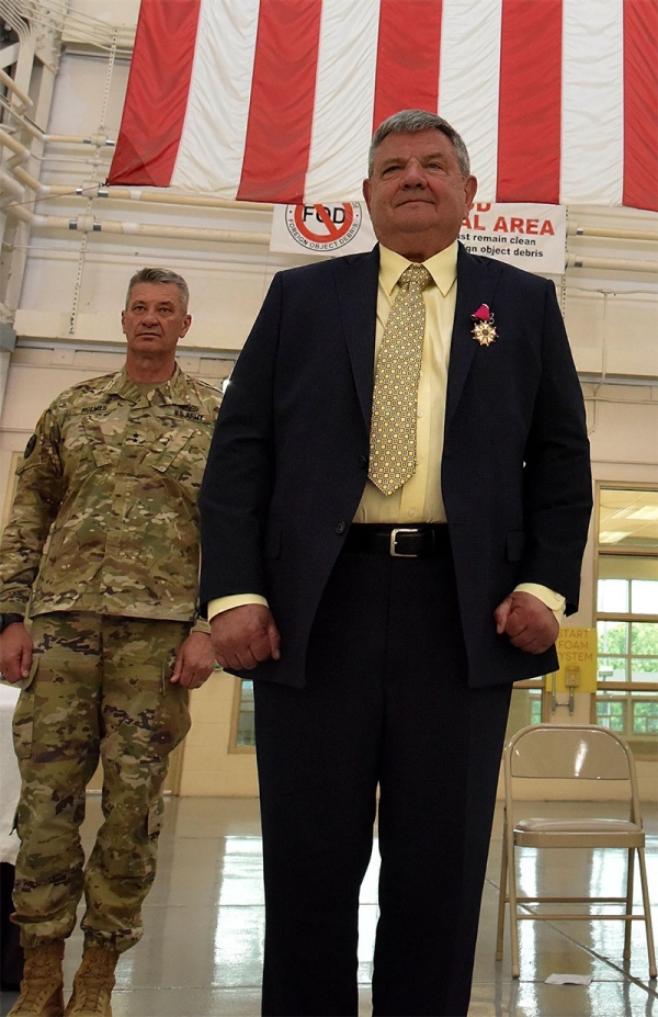 Col. James “Doc” Cooper, from Murfreesboro, is awarded the Legion of Merit from Maj. Gen. Jeff Holmes, Tennessee’s Adjutant General, during his retirement from the Tennessee National Guard on May 1 after serving nearly 47 years. (photo by Sgt. 1st Class Walter E. van Ochten) Col. James “Doc” Cooper, from Murfreesboro, is awarded the Legion of Merit from Maj. Gen. Jeff Holmes, Tennessee’s Adjutant General