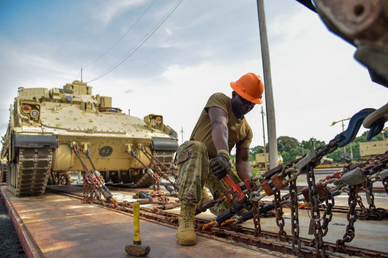 A Soldier assigned to the 278th Armored Cavalry Regiment loads a Bradley Fighting Vehicle onto a train in preparation for movement to Fort Hood, Texas, June 21. Approximately 1,000 vehicles, tanks and pieces of equipment are being loaded onto trains in preparation for XCTC, a three-week training exercise that will be taking place in Fort Hood over the summer. (Photo by Sgt. 1st Class Timothy Cordeiro) A Soldier assigned to the 278th Armored Cavalry Regiment loads a Bradley Fighting Vehicle onto a train in preparation for movement to Fort Hood, Texas, June 21. Approximately 1,000 vehicles, tanks and pieces of equipment are being loaded onto trains in preparation for XCTC, a three-week training exercise that will be taking place in Fort Hood over the summer. (Photo by Sgt. 1st Class Timothy Cordeiro)