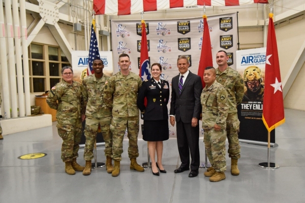 Members of the Tennessee National Guard Education and Incentives Office pose with Gov. Bill Lee, May 17, after he signed an amendment to the Tennessee STRONG Act, at Berry Field Air Force Base, in Nashville. The new legislation affords more educational opportunities for members of the Tennessee National Guard, to include payment for attending Tennessee Colleges of Applied Technology and reimbursement towards tuition for graduate degrees. (Photo by Staff Sgt. Timothy Cordeiro) Members of the Tennessee National Guard Education and Incentives Office pose with Gov. Bill Lee, May 17, after he signed an amendment to the Tennessee STRONG Act, at Berry Field Air Force Base, in Nashville. The new legislation affords more educational opportunities for members of the Tennessee National Guard, to include payment for attending Tennessee Colleges of Applied Technology and reimbursement towards tuition for graduate degrees. (Photo by Staff Sgt. Timothy Cordeiro)