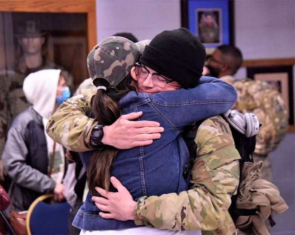 A Soldier with the Tennessee National Guard’s 1st Battalion, 181st Field Artillery Regiment, is greeted by his family after arriving at Smyrna’s Volunteer Training Site, Feb. 6, following a successful 10-month deployment to the Middle East. (photo by Lt. Col. Darrin Haas) A Soldier with the Tennessee National Guard’s 1st Battalion, 181st Field Artillery Regiment, is greeted by his family after arriving at Smyrna’s Volunteer Training Site, Feb. 6, following a successful 10-month deployment to the Middle East. (photo by Lt. Col. Darrin Haas)
