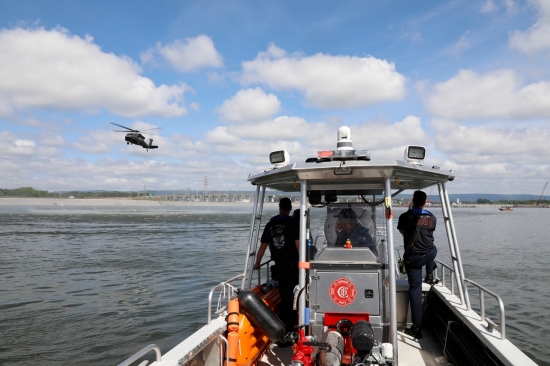 Members of the Chattanooga Fire Department keep watch over volunteers that agreed to act as flooding victims swept into the Chickamauga Dam during a simulated flooding event requiring the efforts of the Helicopter Aquatic Rescue Team Thursday, May 16. The exercise, which simulated a real-life scenario, tested the team’s response time and ability to extract victims quickly and safely from the water, as well as their coordination with local emergency responders. (U.S. Army National Guard photo by Sgt. First Class Mathieu Perry)