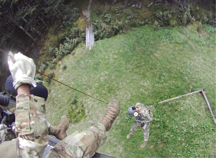 Tennessee Army National Guard Blackhawk helicopter crew chief, Sgt. Daniel Bandy, lowers flight paramedic, Sgt. 1st Class Nolan Ogle, to the ground by hoist to begin rescuing a hiker in respiratory distress in the Great Smoky Mountain National Park, at Mount LeConte Lodge, in the late afternoon of May 31. (submitted photo) Tennessee Army National Guard Blackhawk helicopter crew chief, Sgt. Daniel Bandy, lowers flight paramedic, Sgt. 1st Class Nolan Ogle, to the ground by hoist to begin rescuing a hiker in respiratory distress in the Great Smoky Mountain National Park, at Mount LeConte Lodge, in the late afternoon of May 31. (submitted photo)