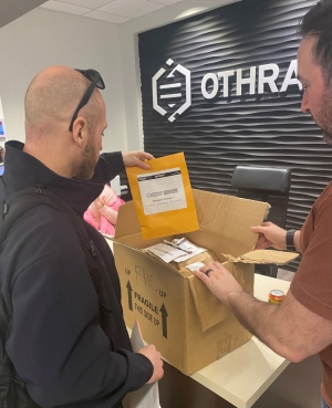 A special agent discusses evidence with a representative from Othram.