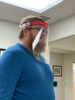 Person wearing face shield Person wearing face shield