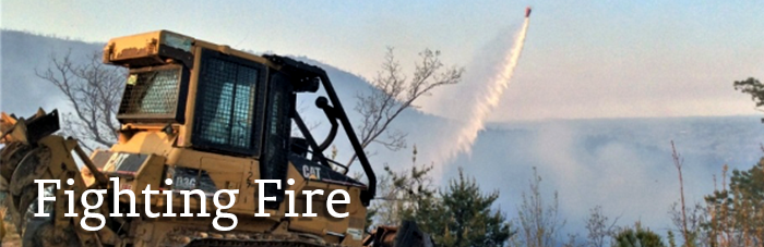 helicopter assisting dozer with wildfire