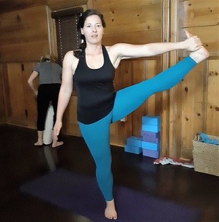 Tara D. Tara in a yoga pose